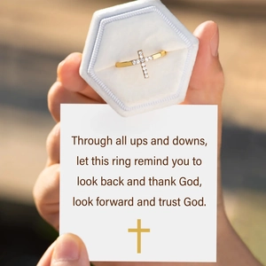 Gold-plated silver cross ring with pavé stones and light blue velvet jewelry gift box