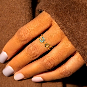 S925 sterling silver gold safety pin open ring with blue cubic zirconia on model