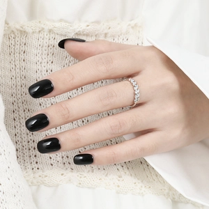 Minimalist S925 sterling silver leaf ring with sparkling zircons worn by a female model