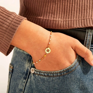 S925 sterling silver colorful enamel snowflake bracelet on female model's wrist