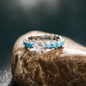 Vintage S925 sterling silver ring with turquoise stones and a clear zircon center