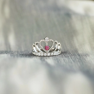 Elegant S925 sterling silver crown ring featuring a pink gemstone and pave white zircons