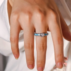 Minimalist s925 silver ring featuring round turquoise stones and a sparkling center diamond