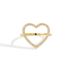 Macro shot of gold heart-shaped ring with pavé-set sparkling zircons on white background