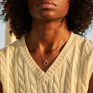 Elegant S925 sterling silver twisted circle necklace with zircon pavé on a model