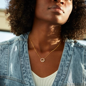 Close-up of S925 silver double heart pendant necklace with shimmering zircon circle