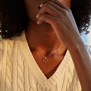 Minimalist S925 sterling silver gold twisted circle necklace with zircon on a model