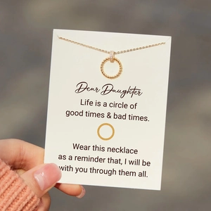 Elegantly crafted gold rope chain necklace with a diamond-encrusted circle pendant