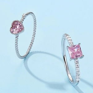 S925 sterling silver rings with pink heart and square zircons on light blue background