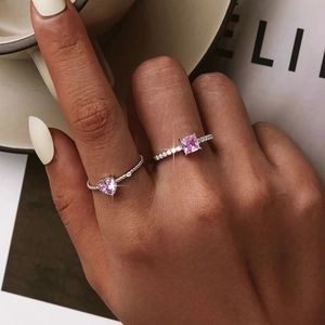 S925 sterling silver rings with pink heart and square gems on a model's hand