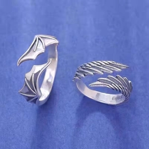 S925 sterling silver angel and demon wing open rings for couples on blue background