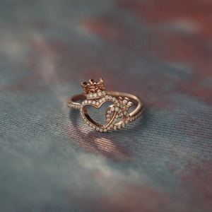 Elegant rose gold S925 silver ring featuring double heart crown with pavé crystals