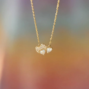 Elegant gold S925 sterling silver double heart necklace with pavé set cubic zirconia