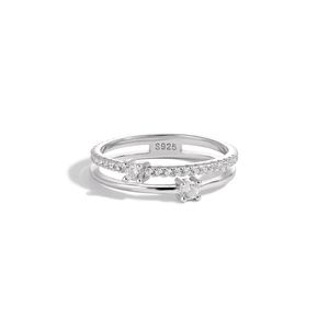 Macro shot of double-layer S925 silver ring featuring pave diamonds and four-prong settings