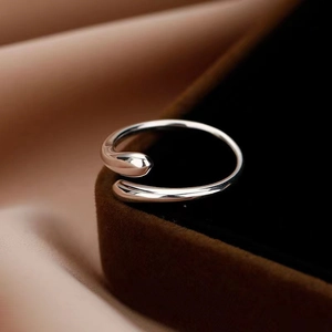 Polished S925 sterling silver minimalist teardrop open ring on a velvet jewelry box