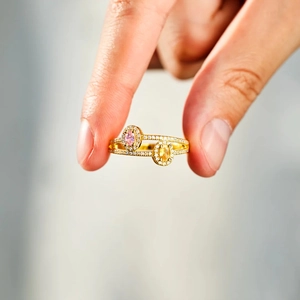 Detail view of s925 silver double oval ring with pink and yellow zircons and pave accents