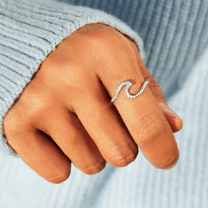 S925 sterling silver wave ring with sparkling zircons worn on model finger