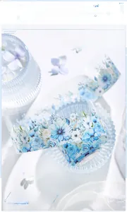 Detailed PET decorative tape showing blue winter flowers and leaves in a snowy garden style