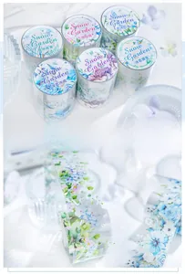 Detail of Snow Garden PET tape featuring blue and purple floral scrapbooking designs