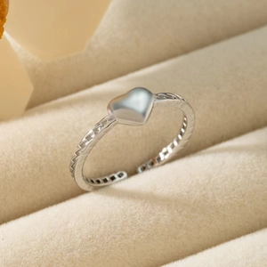 Adjustable S925 sterling silver heart ring with textured band in a jewelry gift box