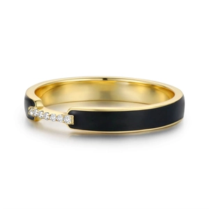 Detail of gold ring with black enamel and seven sparkling stones in a bridge setting