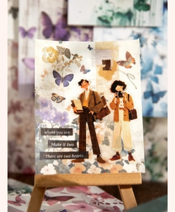 Close-up of vintage couple illustration scrapbooking card with butterfly and floral motifs