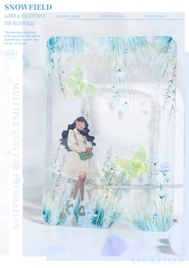 Detail of Snowfield acrylic stand with girl illustration and green butterflies