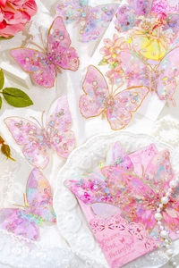 Detail of pink 3D laser butterfly stickers with dreamy girl illustration and lace decor