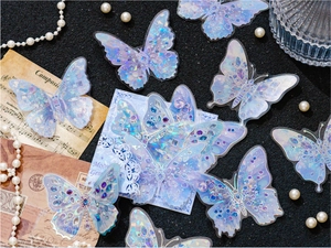 Close-up of laser PET butterfly stickers with gem textures on vintage background