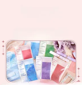 Detailed view of artistic light and shadow paper pack in soft peach and blue tones