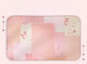 Detailed view of layered pink aesthetic scrapbooking paper with various textures