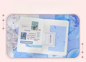Flat lay of artistic light and shadow paper set with blue theme decorations and grid journal