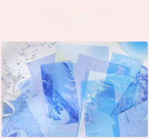 Translucent blue-purple aesthetic scrapbooking paper with marbling and sand flow patterns