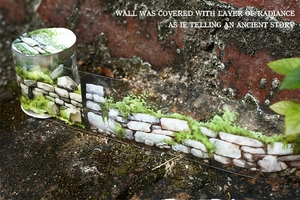 Macro detail of PET tape showing realistic stone wall and moss texture for journaling