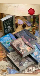 Close-up of vintage scrapbook paper sets in elegant book-style packaging boxes
