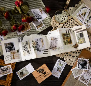 Macro view of vintage postage stamp stickers with butterfly and floral motifs for DIY journals