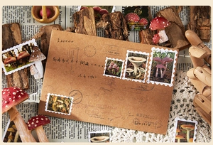 Close-up of vintage mushroom theme stamp stickers and retro kraft envelopes on newsprint