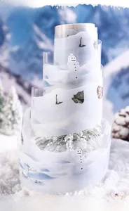 Detailed view of snowy PET decorative tape roll with snowman and pine tree motifs