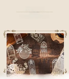 Detailed view of vintage hollow-out scrapbooking paper with gothic window and floral motifs