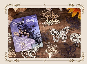 Macro shot of Dream Story vintage hollow paper stickers featuring butterflies and flowers