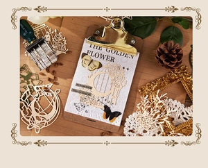 Flat lay of vintage scrapbooking kit with laser-cut paper and metal stationery items