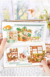 Gros plan d'autocollants PET illustrant la vie domestique sur un carnet à pointillés
