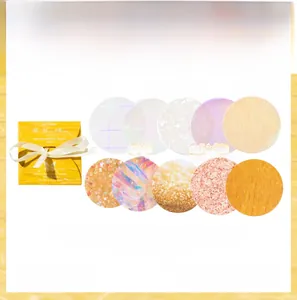Macro detail of shimmer paper circle stickers with laser textures for DIY crafts