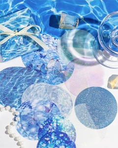 Detail of Starlight and Blue glitter decorative paper with butterfly and wave patterns