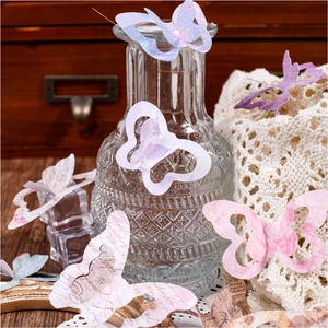 Vintage butterfly paper stickers with artistic text patterns for DIY scrapbook decorating