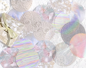 Detailed view of iridescent circular decorative paper with holographic and pearl textures