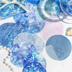 Starry sky themed decorative round stickers with holographic film in a blue gift box