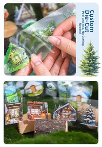 Detailed macro of die-cut PET tape showing forest and cozy cabin stickers for journaling