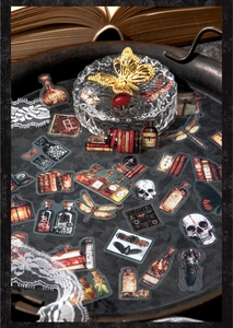 Macro detail of dark academia vintage stickers with butterfly and skull patterns