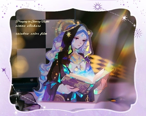 Detail of Sanctuary Light sticker with rainbow film reflecting holographic starry patterns